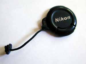 The lens cap, string and flash connector cover